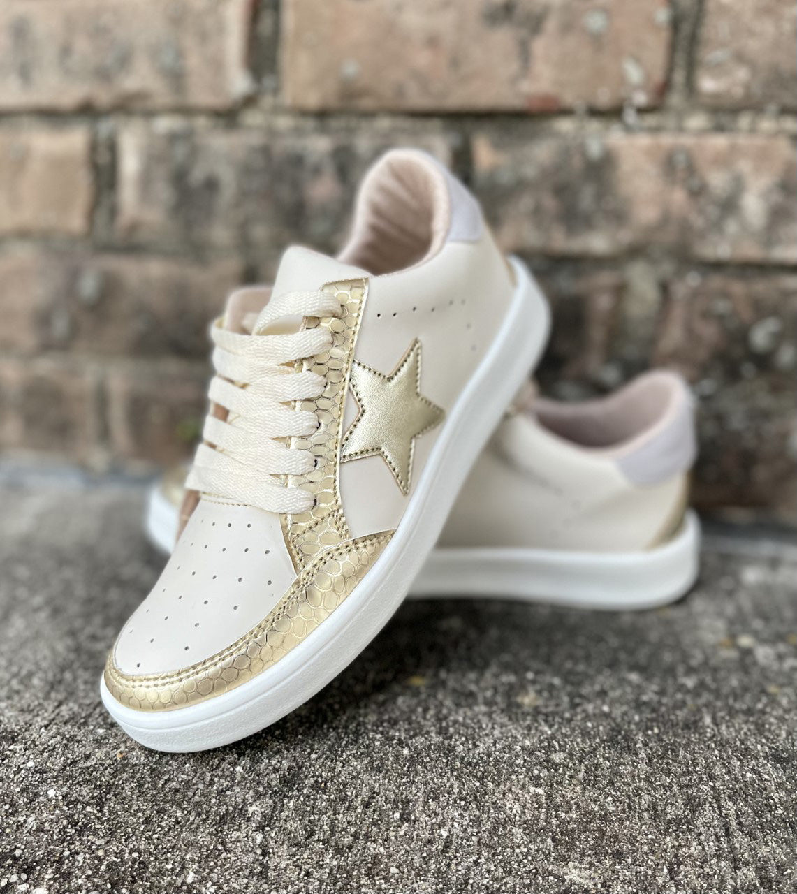 white shoes with gold stars